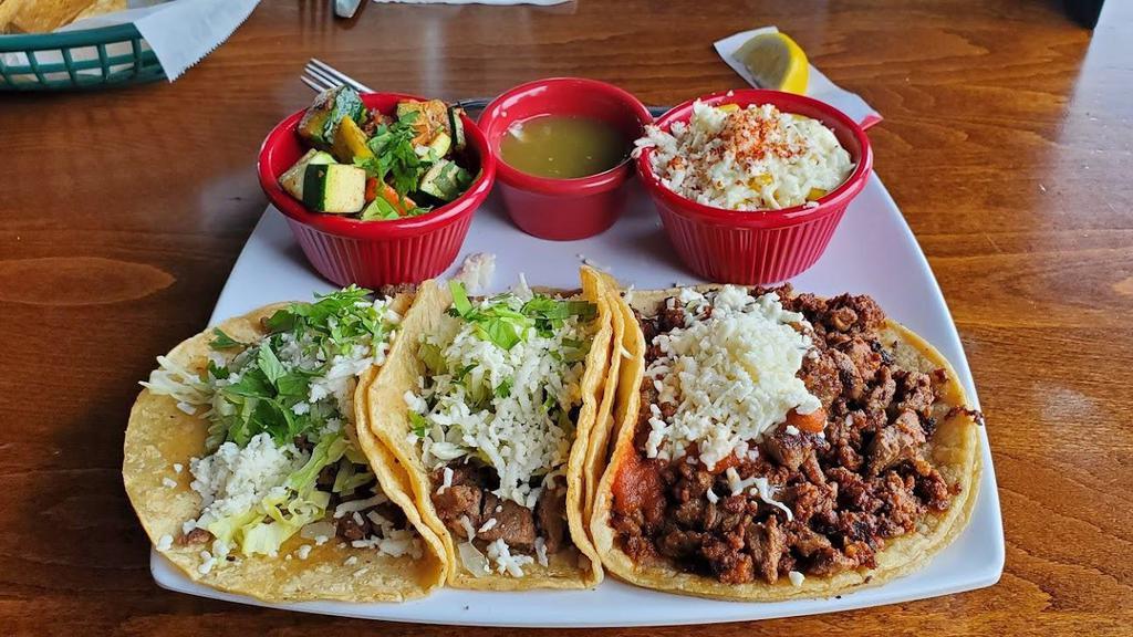 Three Taco Platter · Choose any three tacos. Served with a side of cilantro rice, chipotle black beans and salsa.