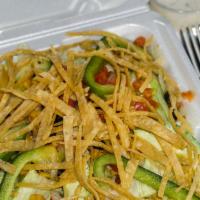 Mexican Street Salad · Fresh chopped spinach, iceberg lettuce, black beans, avocado, corn, red pepper, pico de gall...