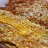 Western Omelette · Diced ham, green peppers, onions and your choice of American, Swiss, cheddar, mozzarella or ...