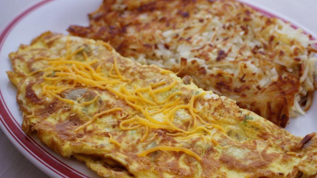 Western Omelette · Diced ham, green peppers, onions and your choice of American, Swiss, cheddar, mozzarella or feta cheese. Served with hash browns, toast & jelly.