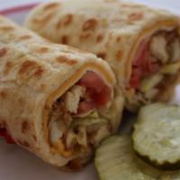 Unique Pita   · Chicken Tenders Crisped to a Golden Brown with pita bread,  Swiss and American cheeses, shre...