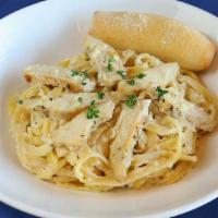 Chicken Alfredo · Grilled boneless breast of chicken covered with a rich, creamy, cheese sauce served over Spa...