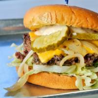 The Spag Burger · 8 ounce char grilled patty specially seasoned with lettuce, American cheese, pickles, grille...