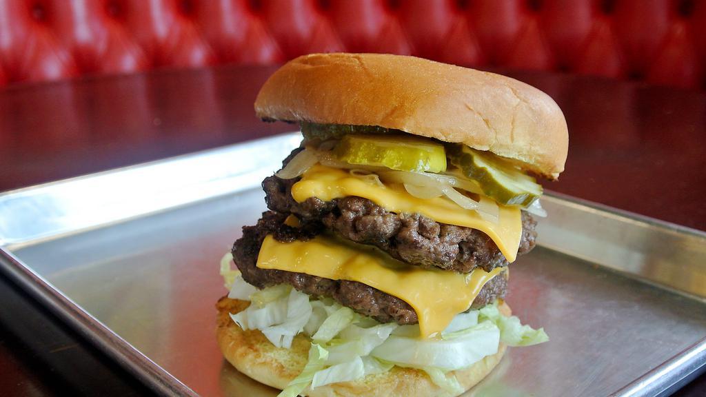 Big Kahuna · Two 8 ounce spagburger patties, grilled onions, lettuce, double cheese, pickle and spag zip sauce.