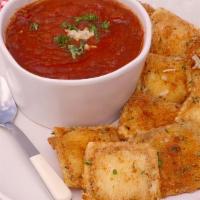 Fried Ravaoli Cheese · Cheese filled, lightly breaded, then deep fried and served with warm marinara. A bar favorite.