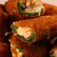 Jalapeño Poppers · Large jalapeño pieces filled with cream cheese.