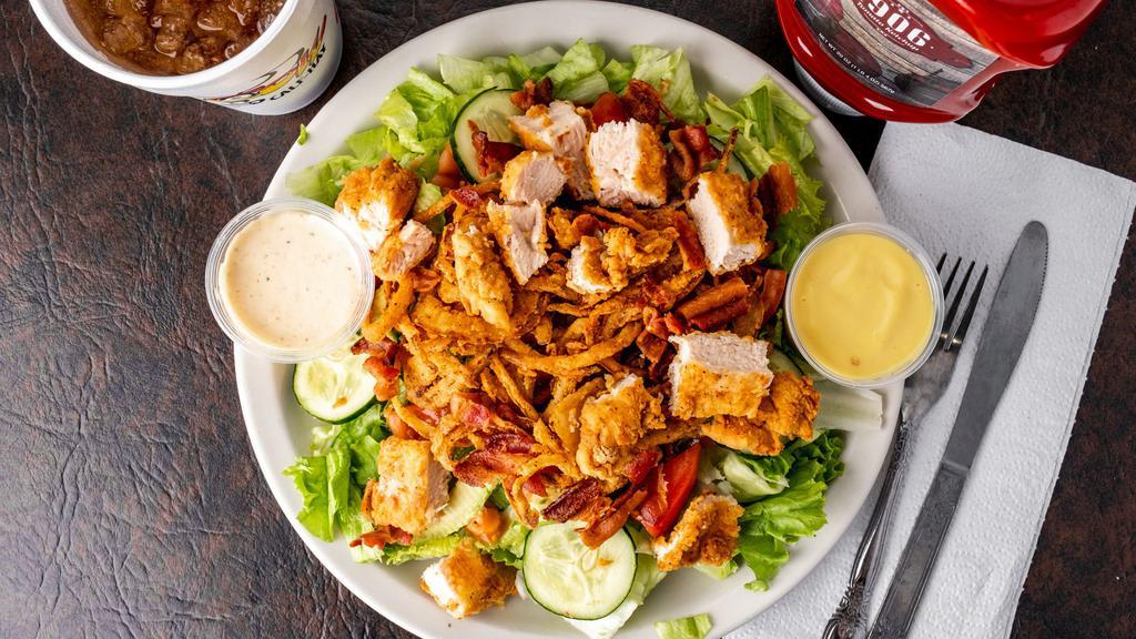 California Cow Salad · A bed of our lettuce mix, served with fresh tomatoes, avocado slices, cucumbers, bacon pieces, hand breaded or grilled chicken breast, topped with our homemade crispy onion stings, served with your choice of dressing.