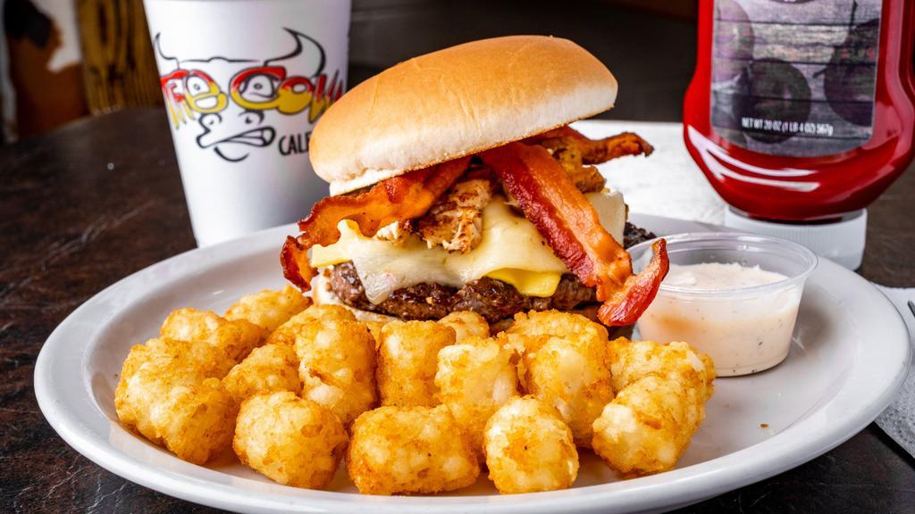 Mad Cow Burger · Premium black Angus beef topped with tender diced grilled chicken, American cheese, Pepper Jack cheese, potatoes, smoked bacon and homemade spicy ranch.