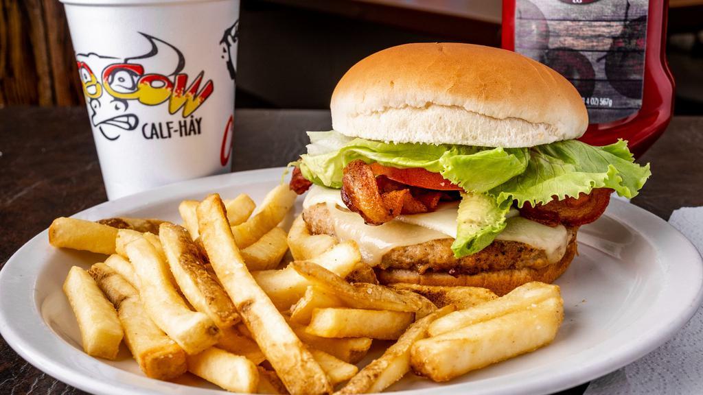 California Turkey Burger · All white meat turkey patty topped with Swiss cheese, smoked bacon, avocado, crisp lettuce, fresh tomatoes and garlic mayo.