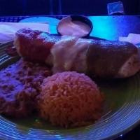 Burrito Borracho · Your choice of meat enveloped with Lettuce, tomatoes, onions, refried beans, shredded Monter...