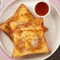 French Toasties · Two pieces of fresh bread battered in egg, milk, and cinnamon cooked until spongy and golden...