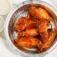 Hot Wings 6 Pieces · Traditional hot wings sauce, delicious flavor, exhilarating heat. Served with ranch or blue ...