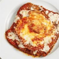 Eggplant Parmigiana · Breaded eggplant topped with marinara sauce and our 4 cheese blend, then oven-baked, served ...