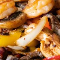 Fajitas · Choice of steak or chicken grilled with onion, bell peppers and mushrooms, served with rice,...