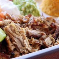 Carnitas · Mexican style pulled pork cooked with onions. Served with rice, beans, and your choice of co...