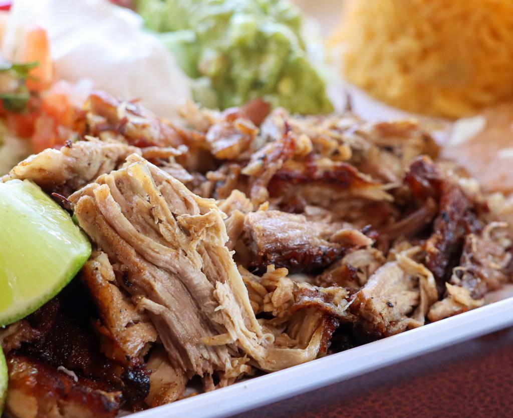 Carnitas · Mexican style pulled pork cooked with onions. Served with rice, beans, and your choice of corn or flour tortillas.