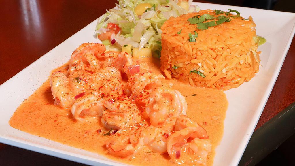 Camarón A La Diabla · A dozen grilled shrimp, onions and bell peppers cooked in spicy salsa. Served with rice, beans, lettuce, sour cream, and tomato. Your choice of corn or flour tortilla.