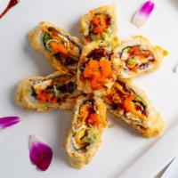 Fantastic Melody Roll · Tempura fried spicy crabmeat, avocado and cream cheese topped with spicy mayo, eel sauce, sc...