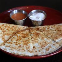 Smoked Chicken Quesadilla · Smoked chicken thigh, poblano peppers, corn and pepper jack cheese. Served with roasted sals...