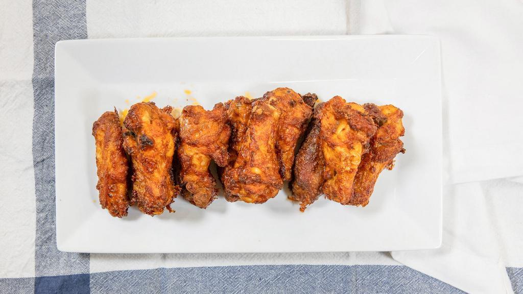 Hot N' Spicy · A full pound of oven-roasted chicken wings baked to perfection and tossed in our fiery buffalo sauce. Served with your choice of ranch Or blue cheese dressing.