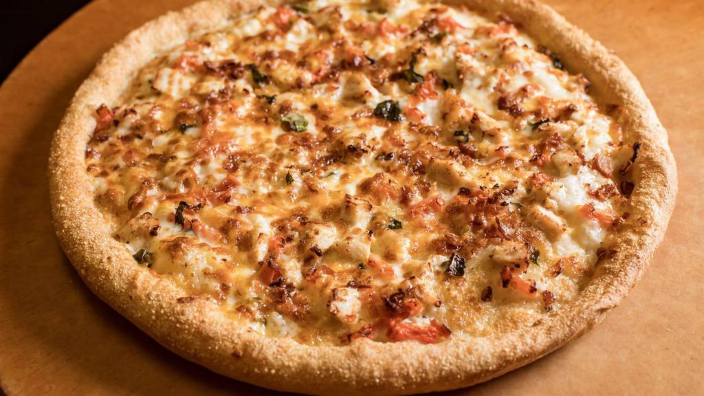 Alfredo Chicken · Sarpino's traditional pan pizza baked to perfection and topped with tender chicken strips, crispy bacon, parmesan, our signature gourmet cheese blend and creamy alfredo sauce.