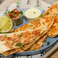 Vida Quesadilla · Mouthwatering Quesadilla with your choice of protein, your choice of cheese, with a side of ...