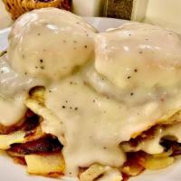 Loaded B & G (Dd) · Two biscuits stuffed with sausage patties then smothered with Sausage gravy, served with two...