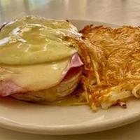 Gc Eggs Benedict (Dd) · Two over-easy eggs, ham, and creamy hollandaise over a toasted English muffin, served with g...