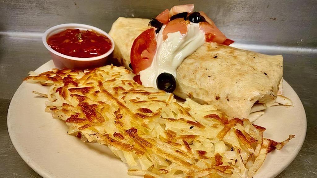 Breakfast Burrito (Dd) · Scrambled eggs, sausage, pepper jack cheese, onions, and green peppers inside a tortilla, topped with sour cream, tomatoes, and black olives, served with salsa, garden potatoes, and choice of a pancakes or a bakery fresh muffin. Sub for Steak + $2.00