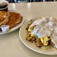 Slugger (Dd) · Scrambled eggs with chunks of chicken fried steak and diced onion, then topped with our saus...