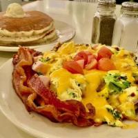 Heavy Hitter (Dd · Scrambled eggs blended with diced bacon, diced ham and vegetables, then topped with american...