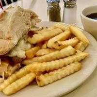 French Dip · thin sliced roast beef, julienned white onion, Swiss cheese, sourdough, served au jus, serve...