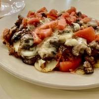 Kansas City Casserole · *sirloin strips cooked medium rare, onions, mushrooms, fresh tomatoes and monterey jack cheese
