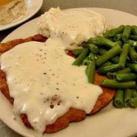 Chicken Fried Steak Dinner · tenderized and breaded beef steak deep-fried and served with mashed potatoes, sausage gravy,...