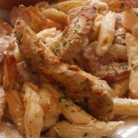 Pasta Bowl · Fettuccine pasta tossed with shrimp, chicken crawfish. Andouille sausage creamy alfredo sauc...
