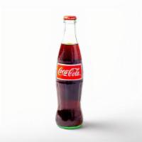 Mexican Coke · 12 oz glass bottle of Coke, sweetened with real cane sugar and imported from Mexico.