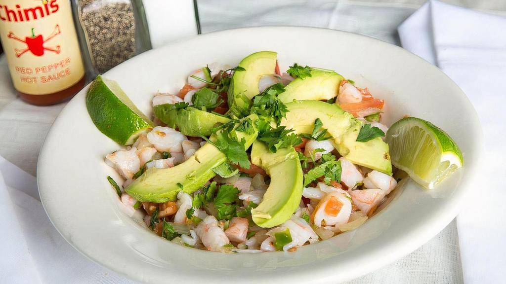 Shrimp Ceviche · Fresh shrimp marinated in lime juice and mixed with pico de gallo. Topped with avocado. The perfect garnish to your chips!