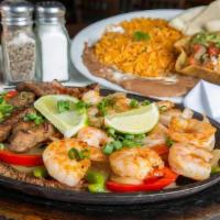 Fajitas For One · A true Chimi's favorite, these fajitas are served on a bed of bell peppers and onions. Homem...
