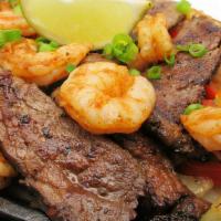 Fajitas For Two · A true Chimi's favorite, these fajitas are served on a bed of bell peppers and onions. Homem...