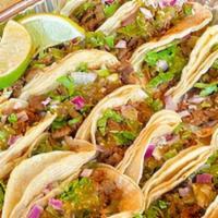 Street Tacos Family Pack · 15 street tacos with your choice of meat (up to two) served with rice, beans, chips and salsa