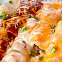 Enchilada Family Pack · You choice of enchiladas (up to two different choices), served with rice and beans, chips an...