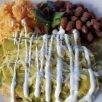 Enchiladas · Served with rice and beans. Four corn tortillas stuffed with red or green sauce, sour cream,...