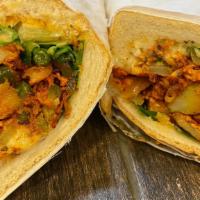 Chicken Sub · Seasoned  Chicken Grilled with Onions, Potatoes, Green Peppers and Mixed Vegetables  on a To...