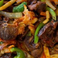 Lamb & Rice · Seasoned Lamb grilled with onions, green peppers, and potatoes over rice. plus  a little spi...