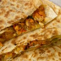 Chicken Quesadilla · Seasoned Chicken Grilled with Onions, Green Peppers, Potatoes and Mixed Veggie on a Toasted ...