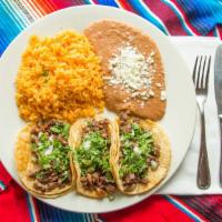 Dinner Tacos · A folded corn tortilla (soft) with your choice of meat. Dressed with shredded lettuce and to...
