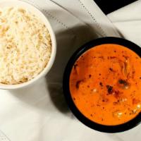 Chicken Tikka Masala · Boneless chicken cubes cooked in cashew nut, onion and tomato paste with onions and capsicum.