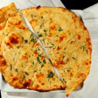 Garlic Naan · Leavened white flour bread topped with chopped garlic and butter.