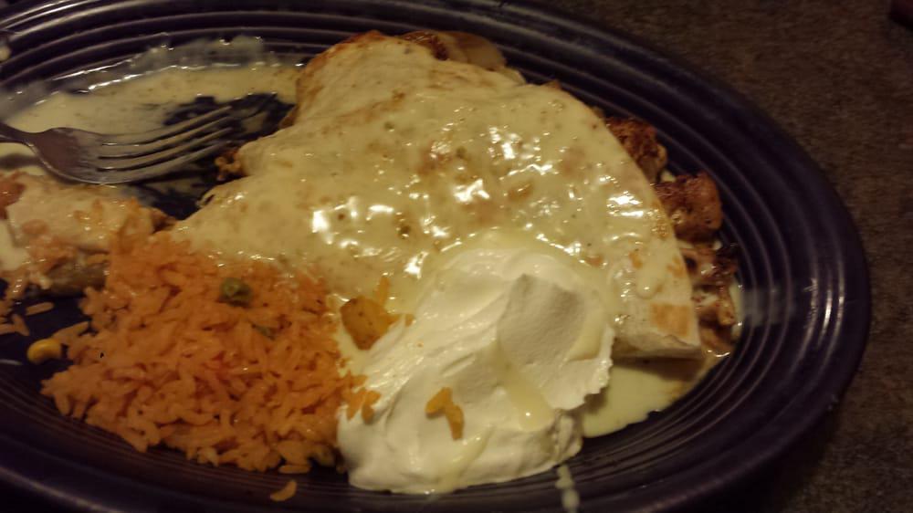Quesadilla Grande · 10 ” flour tortilla filled with grilled steak or chicken, onions and mushrooms. Topped with cheese sauce and served with rice and sour cream.