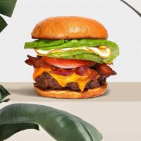 Wake And Bacon Burger  · American beef patty topped with bacon, fried egg, avocado, melted cheese, lettuce, tomato, o...